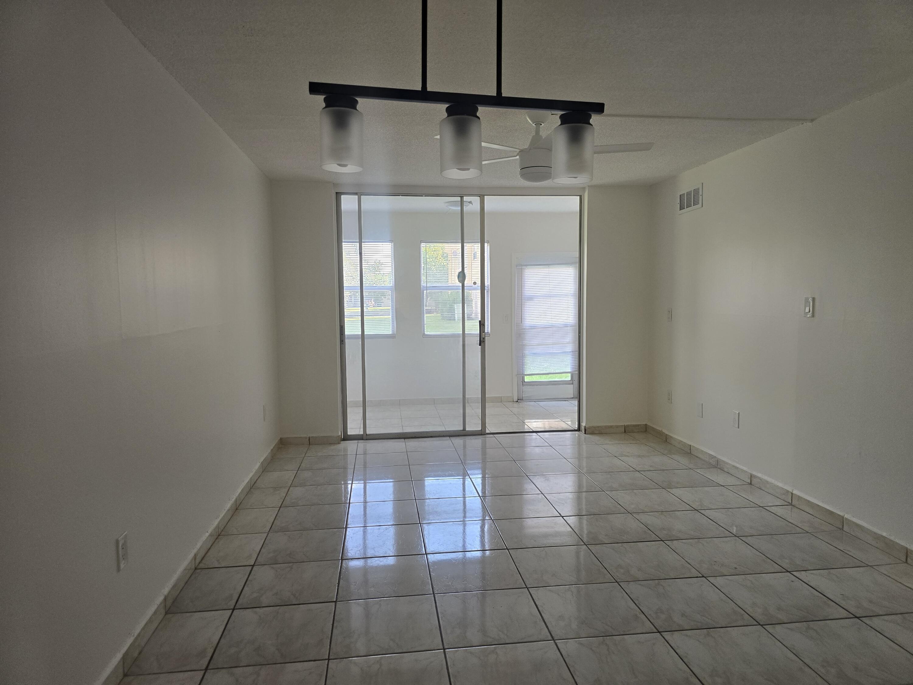 2741 North Pine Island Road, Unit 106 Sunrise, FL 33322 - Photo 6 of 14 a view of a bathroom with a glass door and a shower