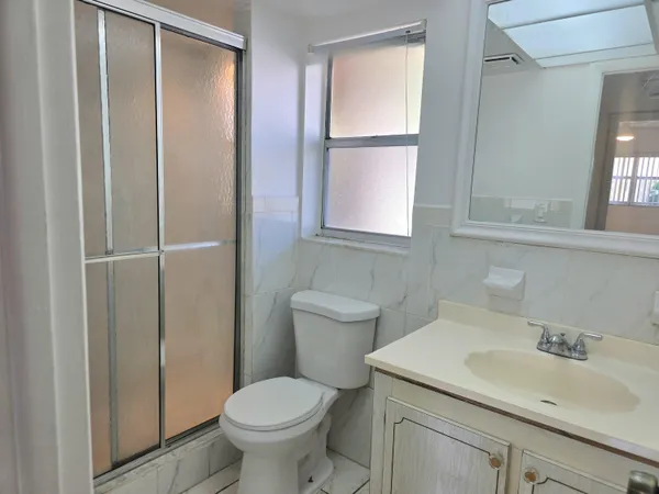 a bathroom with a sink toilet and vanity
