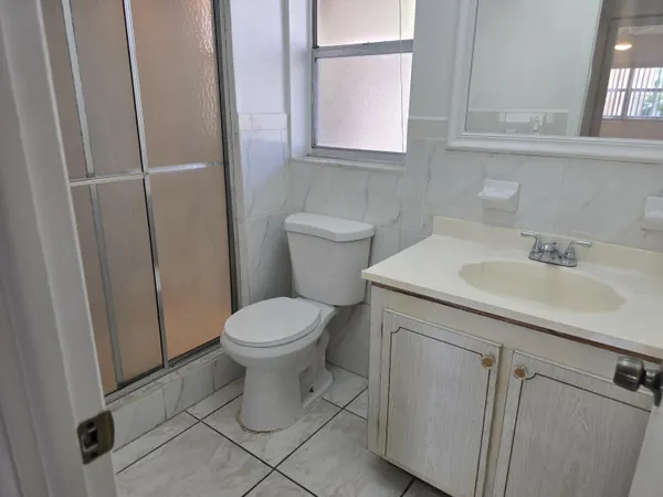 a bathroom with a sink toilet and vanity