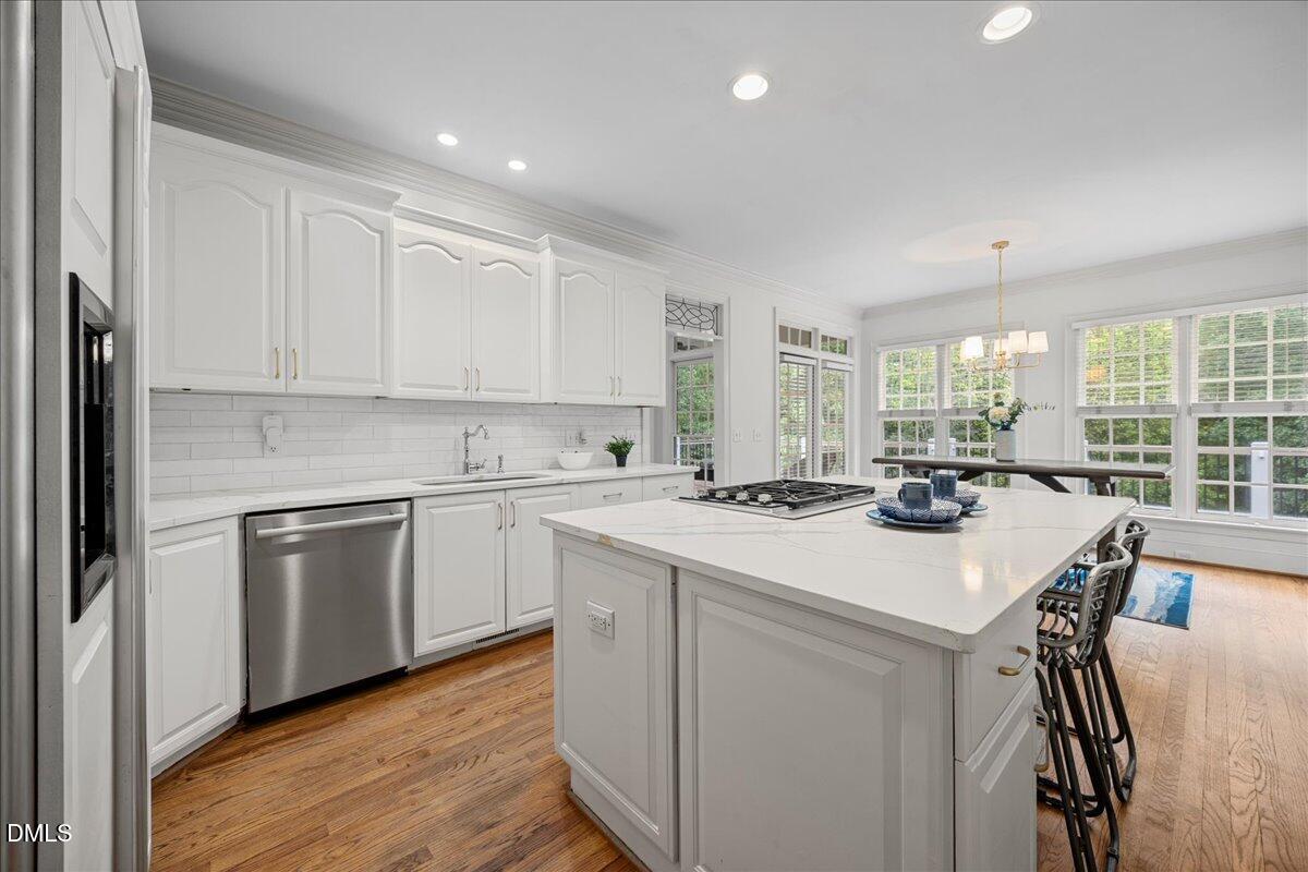 1009 Bentham Drive Raleigh, NC 27614 - Photo 17 of 69 a kitchen with a stove a sink and a refrigerator