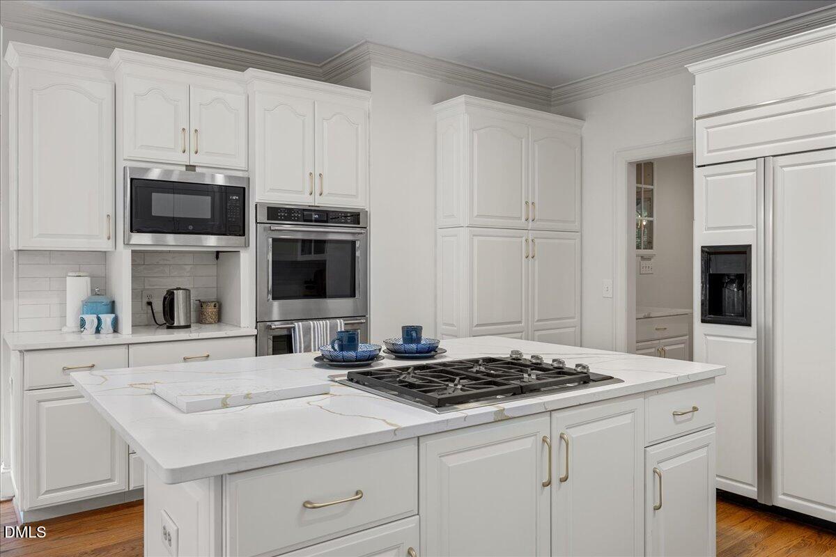 1009 Bentham Drive Raleigh, NC 27614 - Photo 21 of 69 a kitchen with cabinets appliances and a counter space