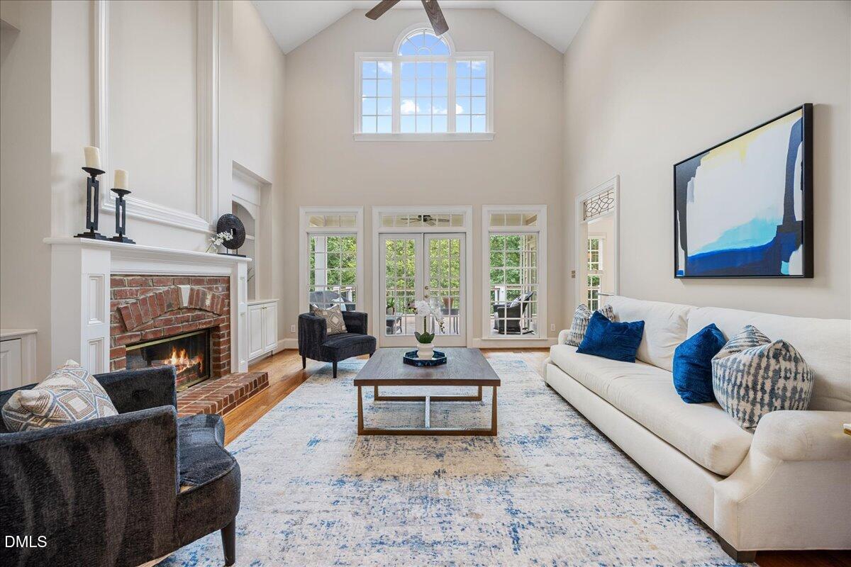 1009 Bentham Drive Raleigh, NC 27614 - Photo 24 of 69 a living room with furniture a fireplace and a large window