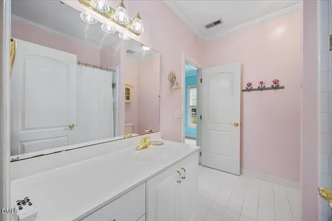 an empty room with a window and ceiling fan