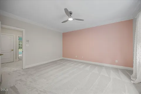a balcony with wooden floor and outdoor seating