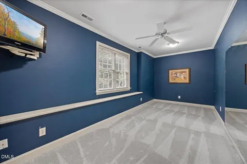 an aerial view of a house with outdoor space and a lake view