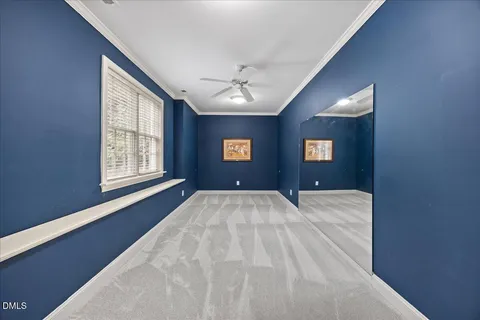 an aerial view of a house with swimming pool and big yard