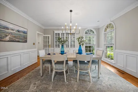 a living room with furniture a rug and a window