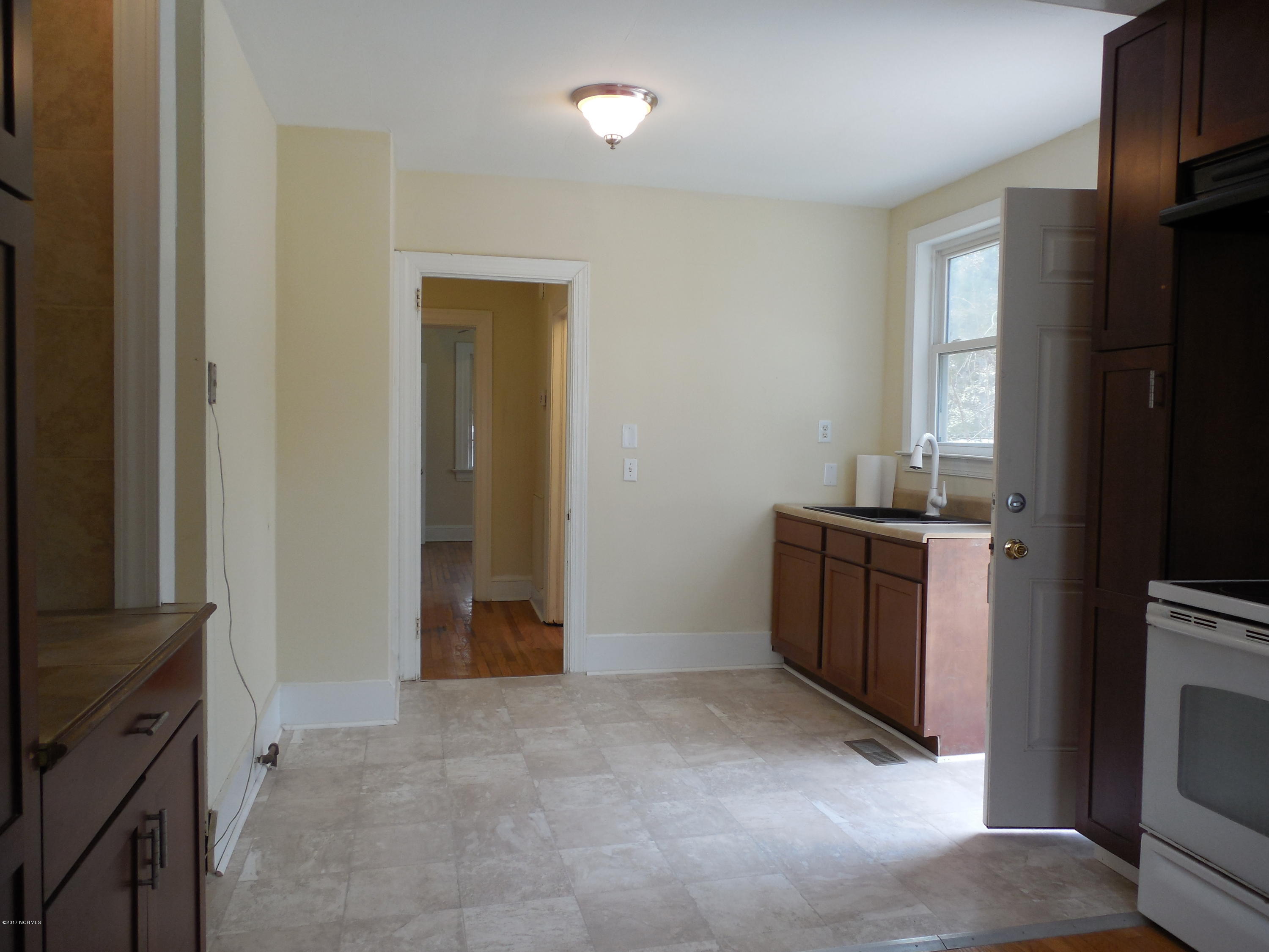 106 Clifton Road Rocky Mount, NC 27804 - Photo 11 of 20 New vinyl flooring, to the left is the washer/dryer hook ups.