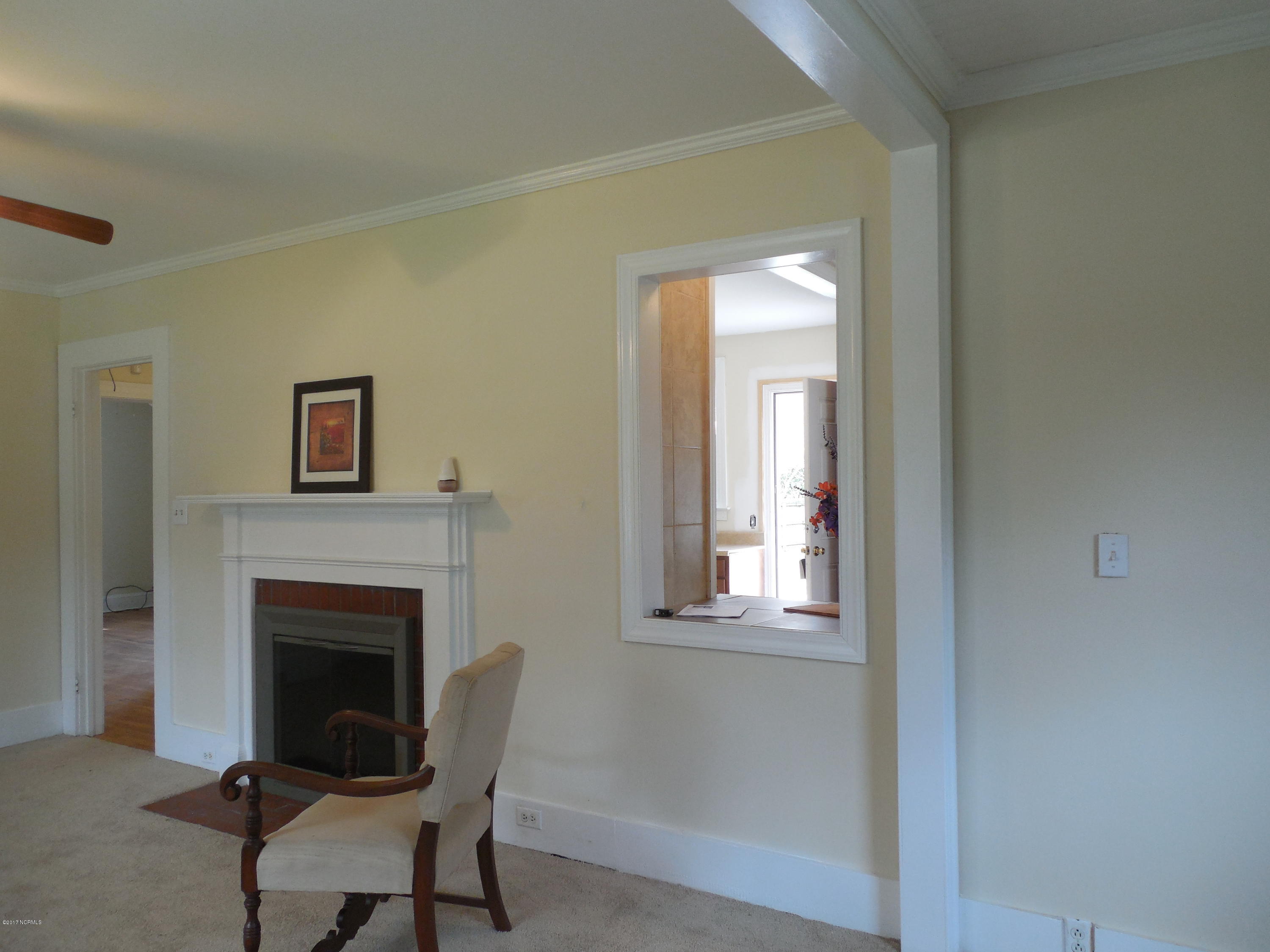 106 Clifton Road Rocky Mount, NC 27804 - Photo 19 of 20 Living room has a pass thru to the kitchen...would make a great bar!