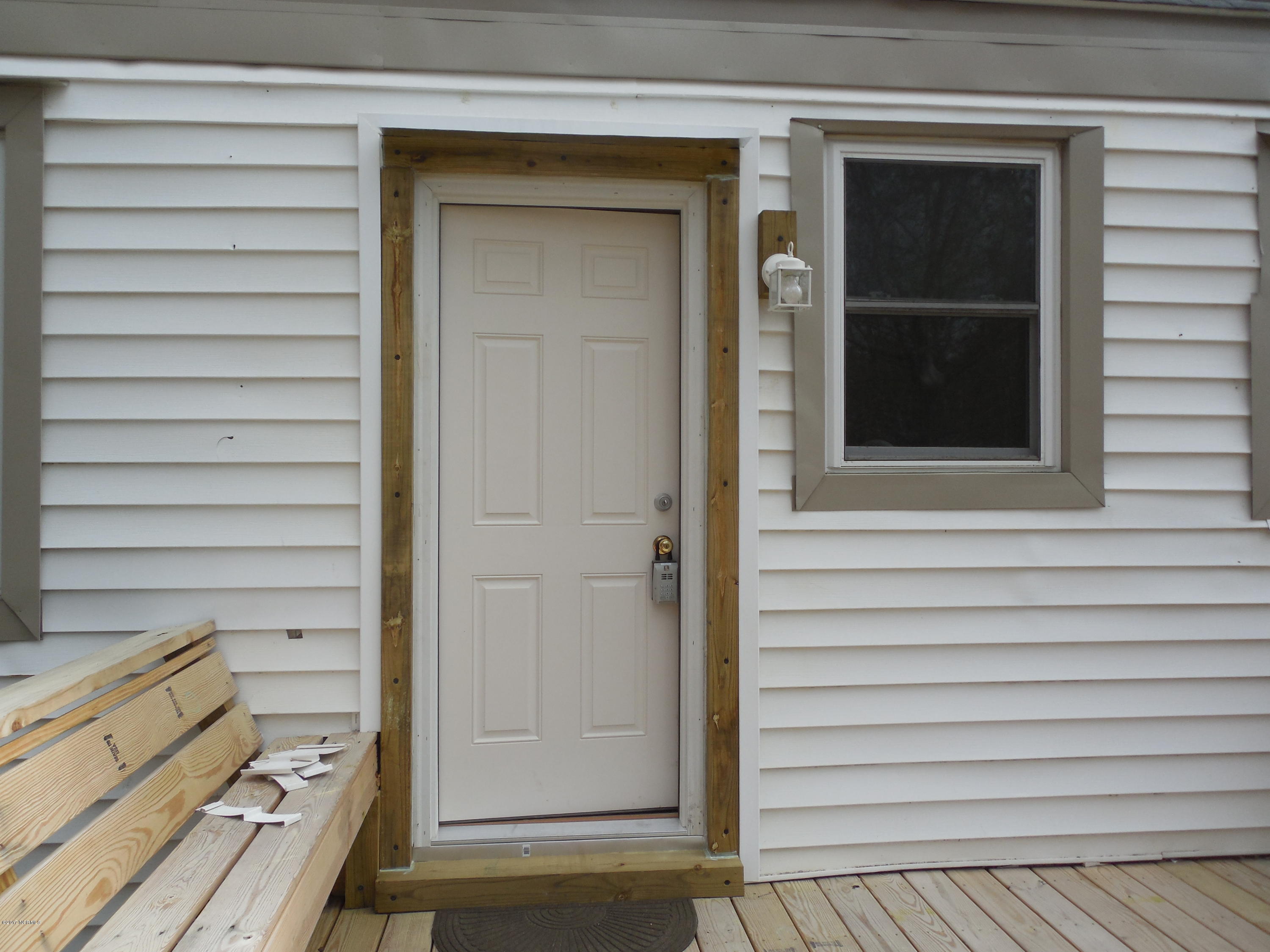 106 Clifton Road Rocky Mount, NC 27804 - Photo 7 of 20 All new rear door and framing, new light.