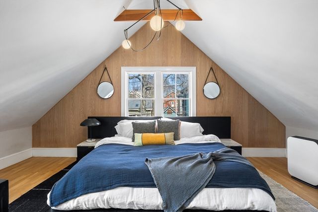 a living room with a bed furniture and a window