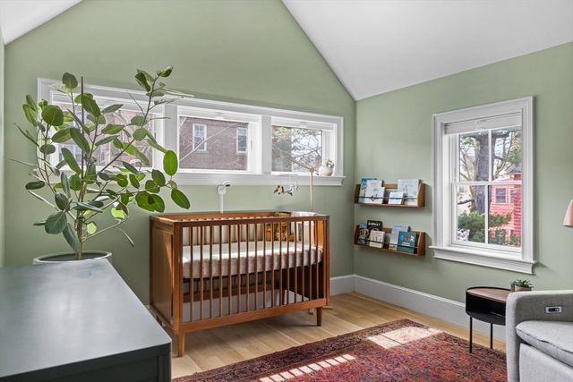 a bedroom with furniture and a window