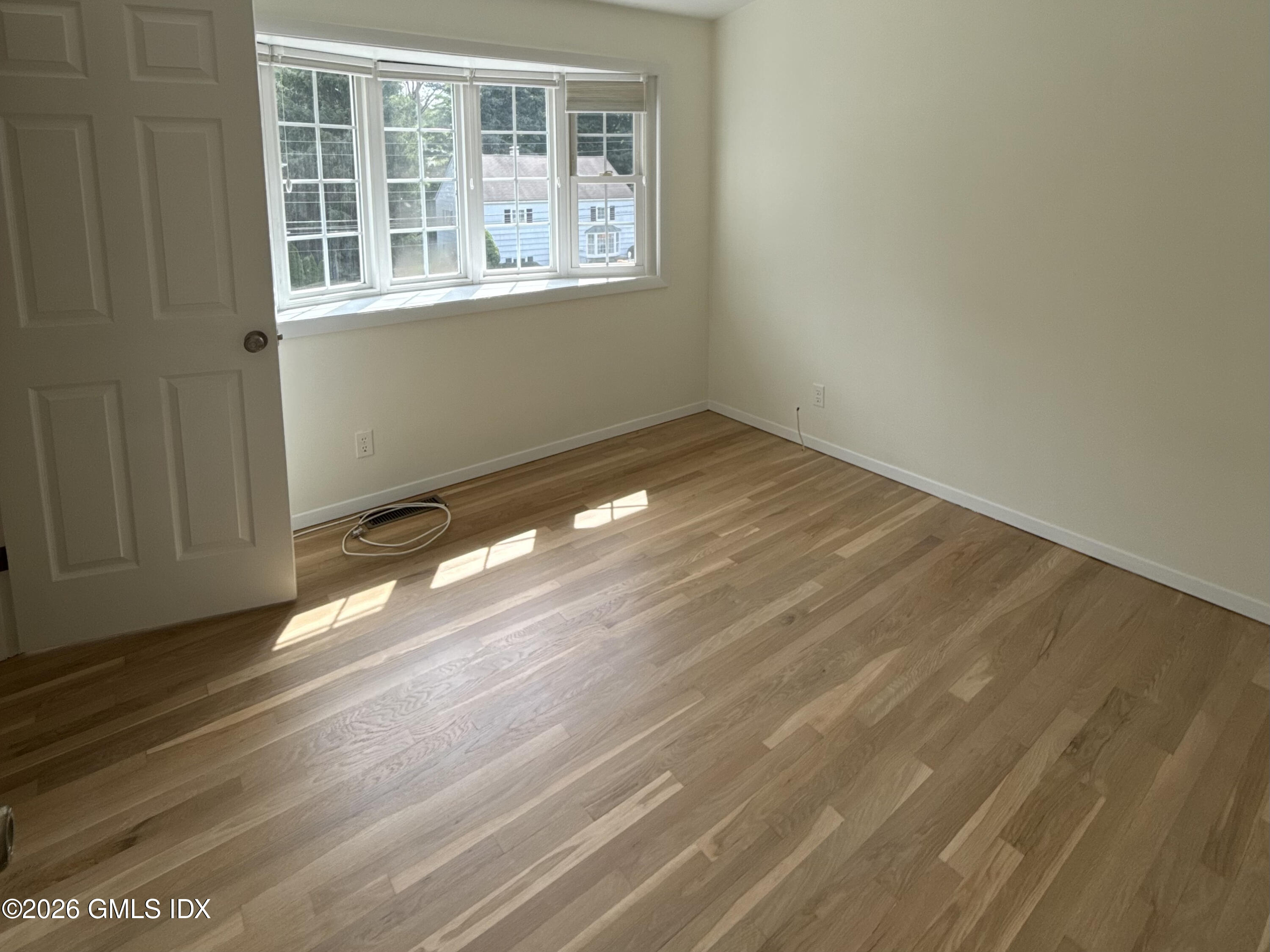 37 Amherst Road Riverside, CT 06878 - Photo 8 of 25 a view of empty room with wooden floor and fan