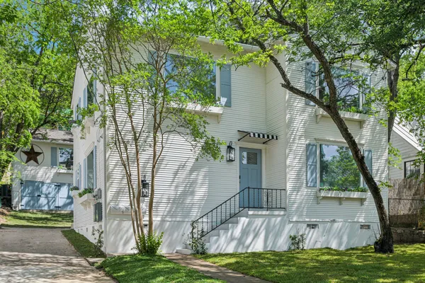 a backyard of a house with lots of green space