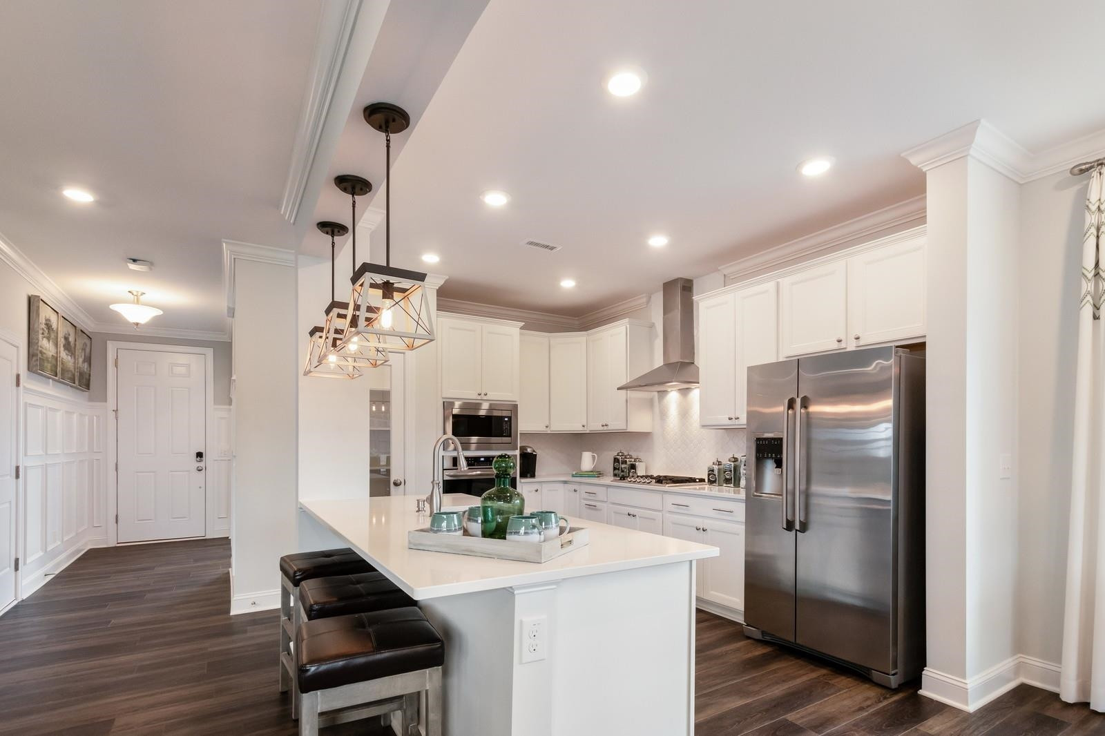 4121 Snowy Range Circle, Unit LANDRUM Raleigh, NC 27616 - Photo 12 of 27 a kitchen with stainless steel appliances a refrigerator sink and microwave