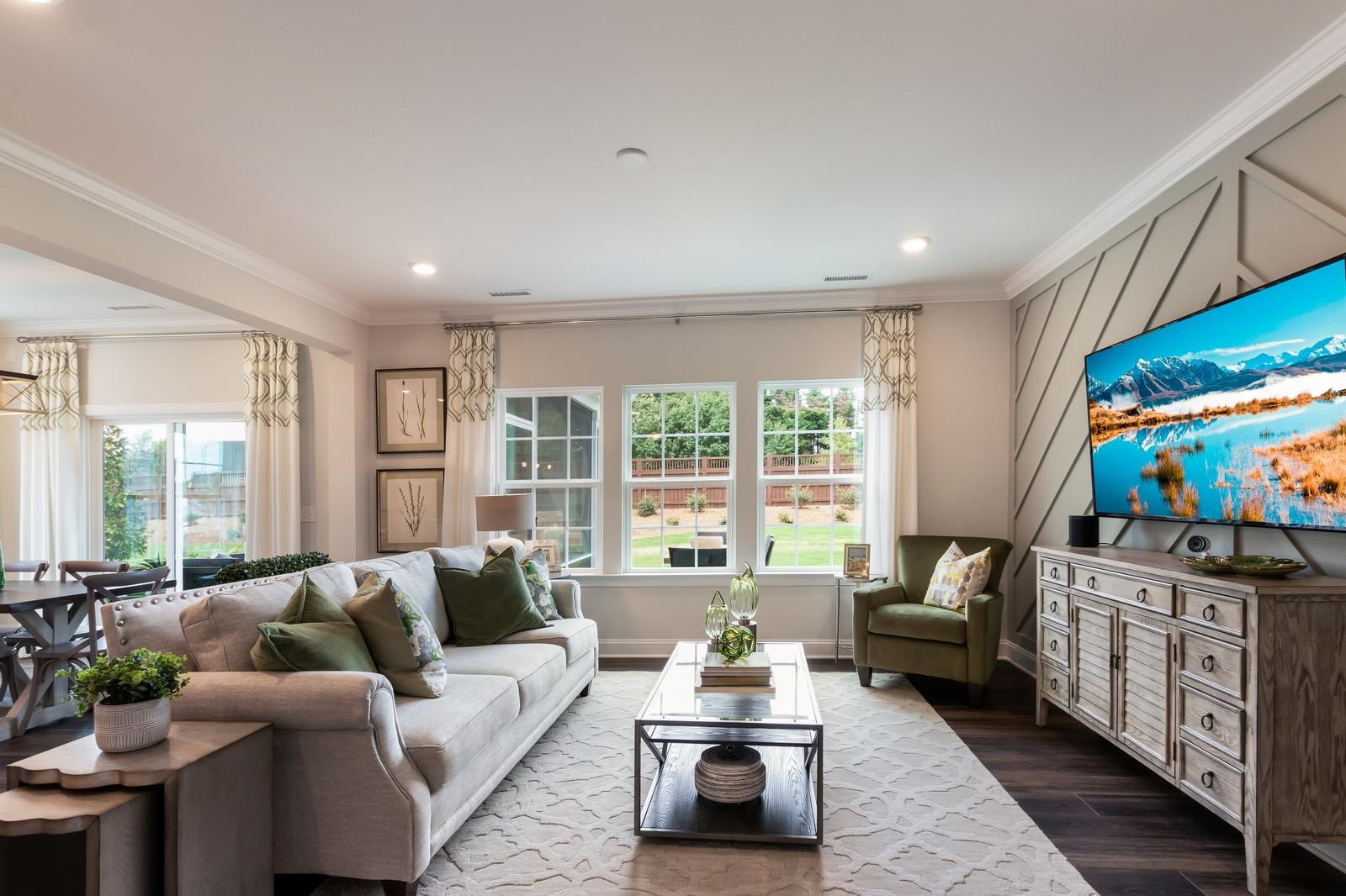 4121 Snowy Range Circle, Unit LANDRUM Raleigh, NC 27616 - Photo 13 of 27 a living room with furniture flat screen tv and a large window