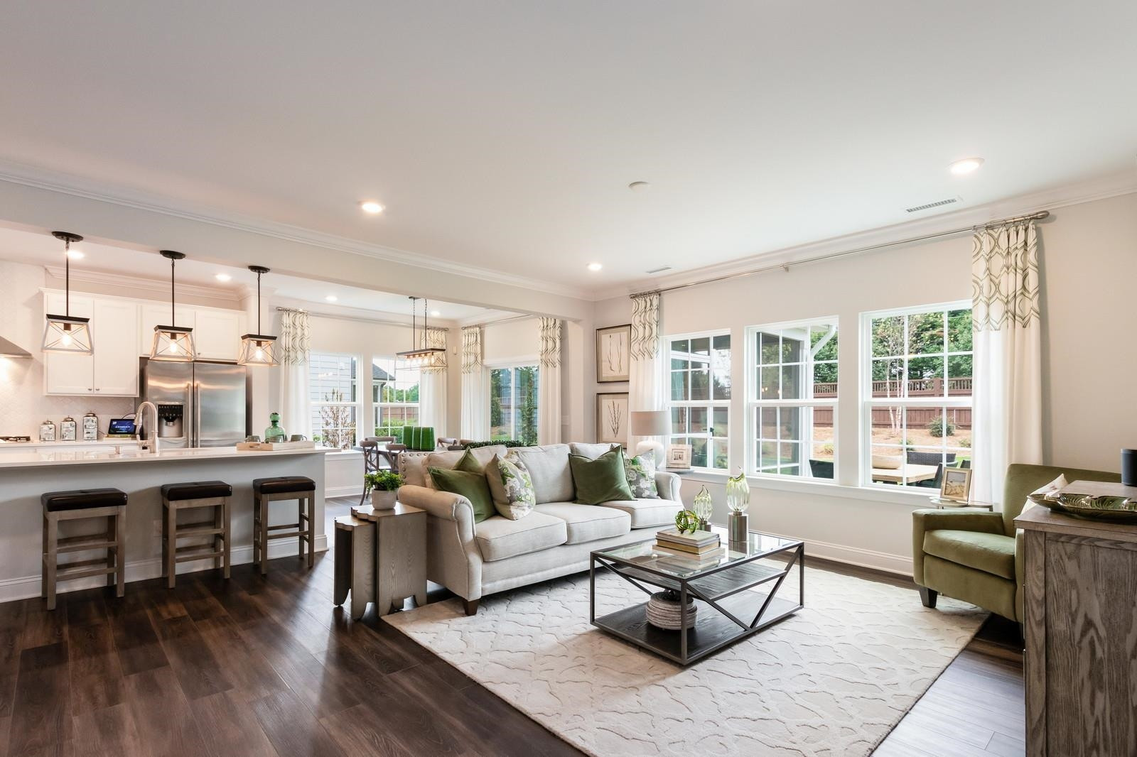 4121 Snowy Range Circle, Unit LANDRUM Raleigh, NC 27616 - Photo 15 of 27 a living room with furniture and wooden floor