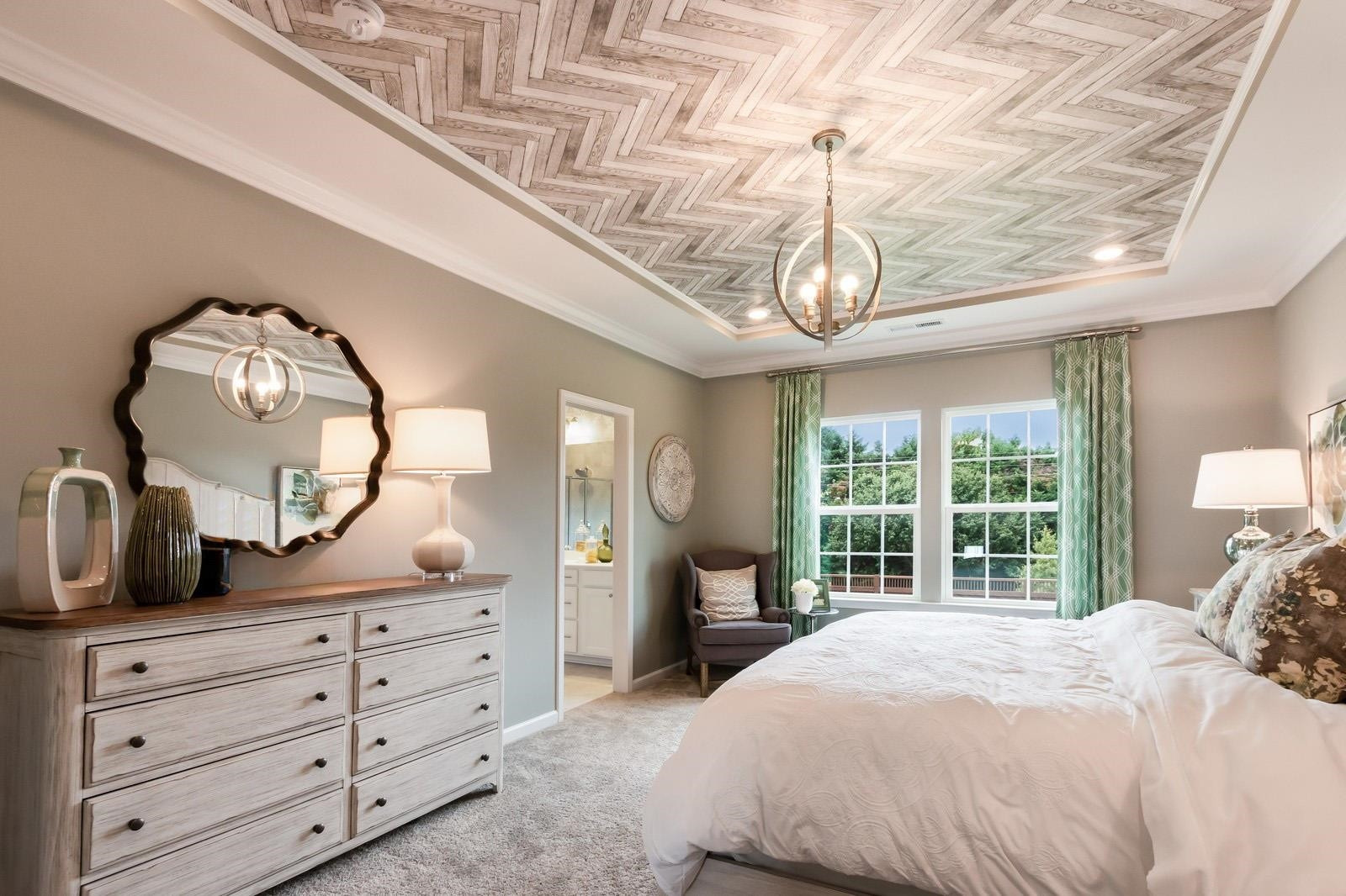 4121 Snowy Range Circle, Unit LANDRUM Raleigh, NC 27616 - Photo 18 of 27 a bedroom with a large bed and a large dresser