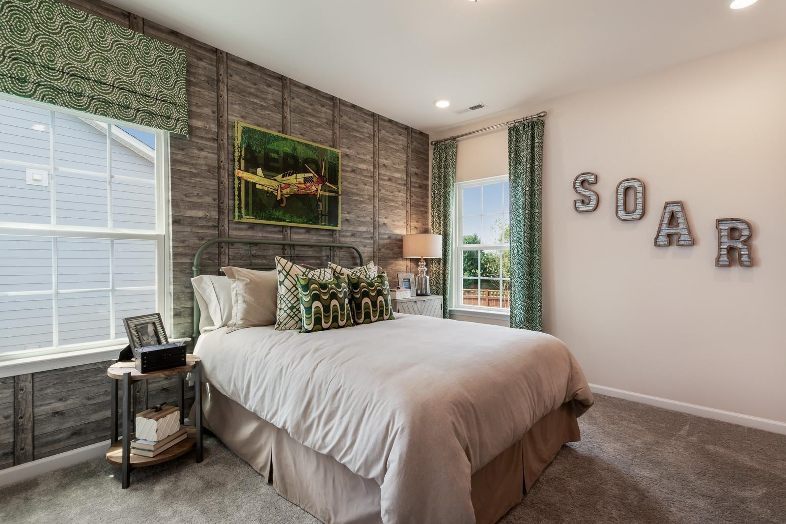 4121 Snowy Range Circle, Unit LANDRUM Raleigh, NC 27616 - Photo 24 of 27 a bedroom with a bed and a window