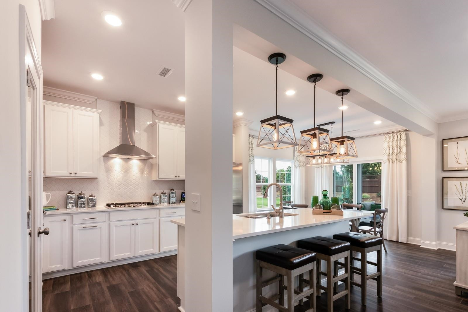 4121 Snowy Range Circle, Unit LANDRUM Raleigh, NC 27616 - Photo 8 of 27 a kitchen with granite countertop white cabinets and white appliances