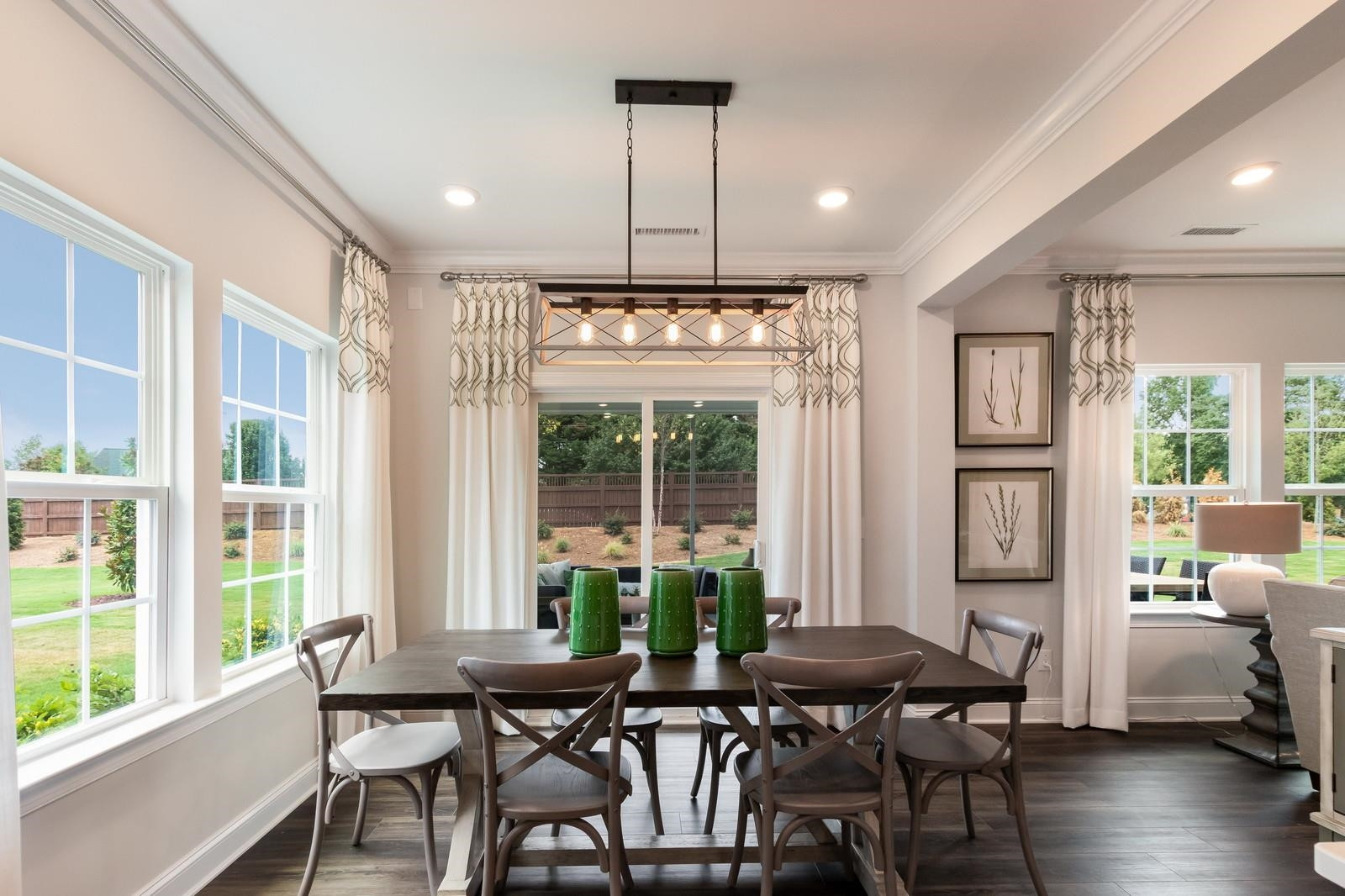 4121 Snowy Range Circle, Unit LANDRUM Raleigh, NC 27616 - Photo 9 of 27 a view of a dining room with furniture window and wooden floor