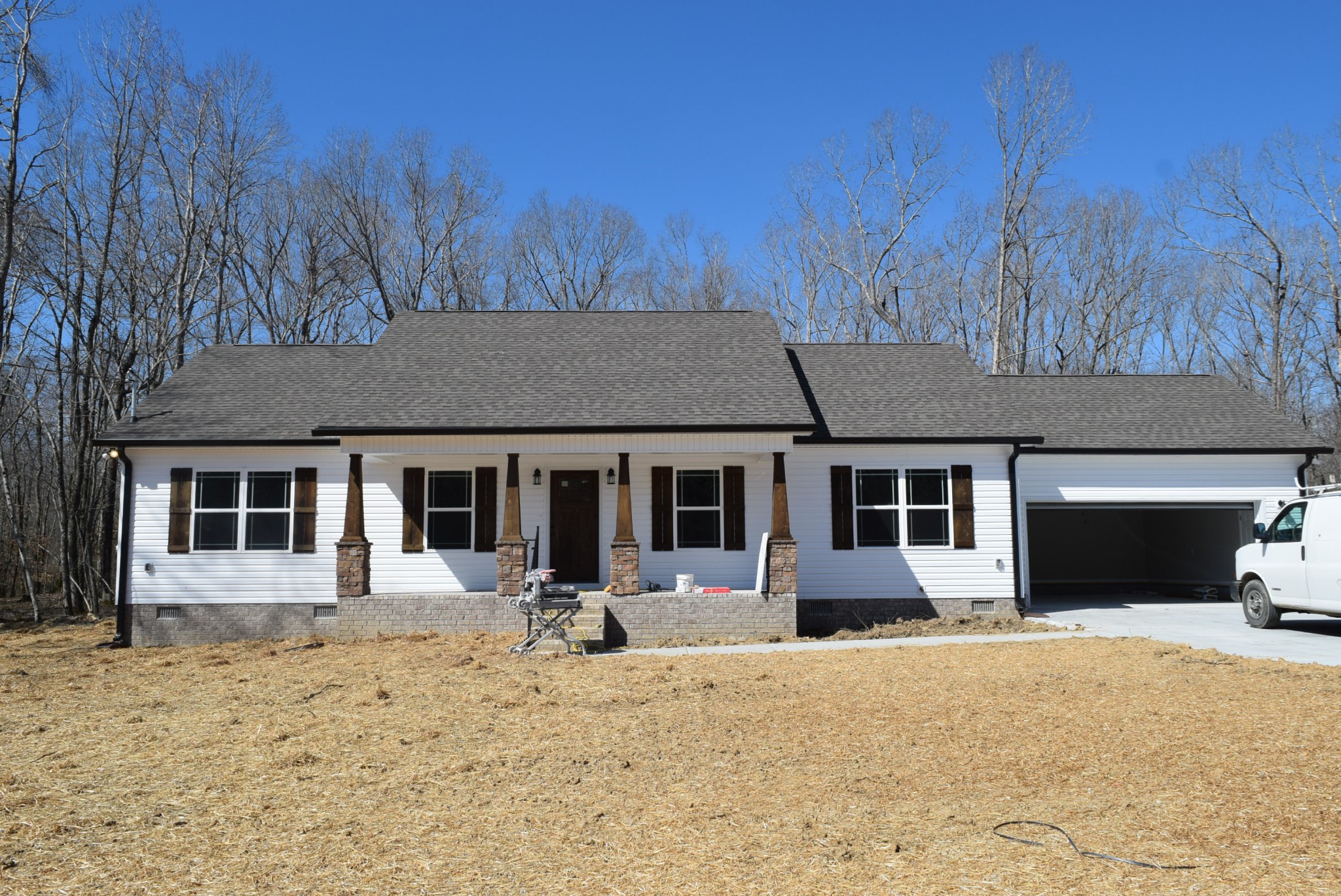 560 Ballard Road Manchester, TN 37355 - Photo 1 of 7 a front view of a house with a yard covered in snow