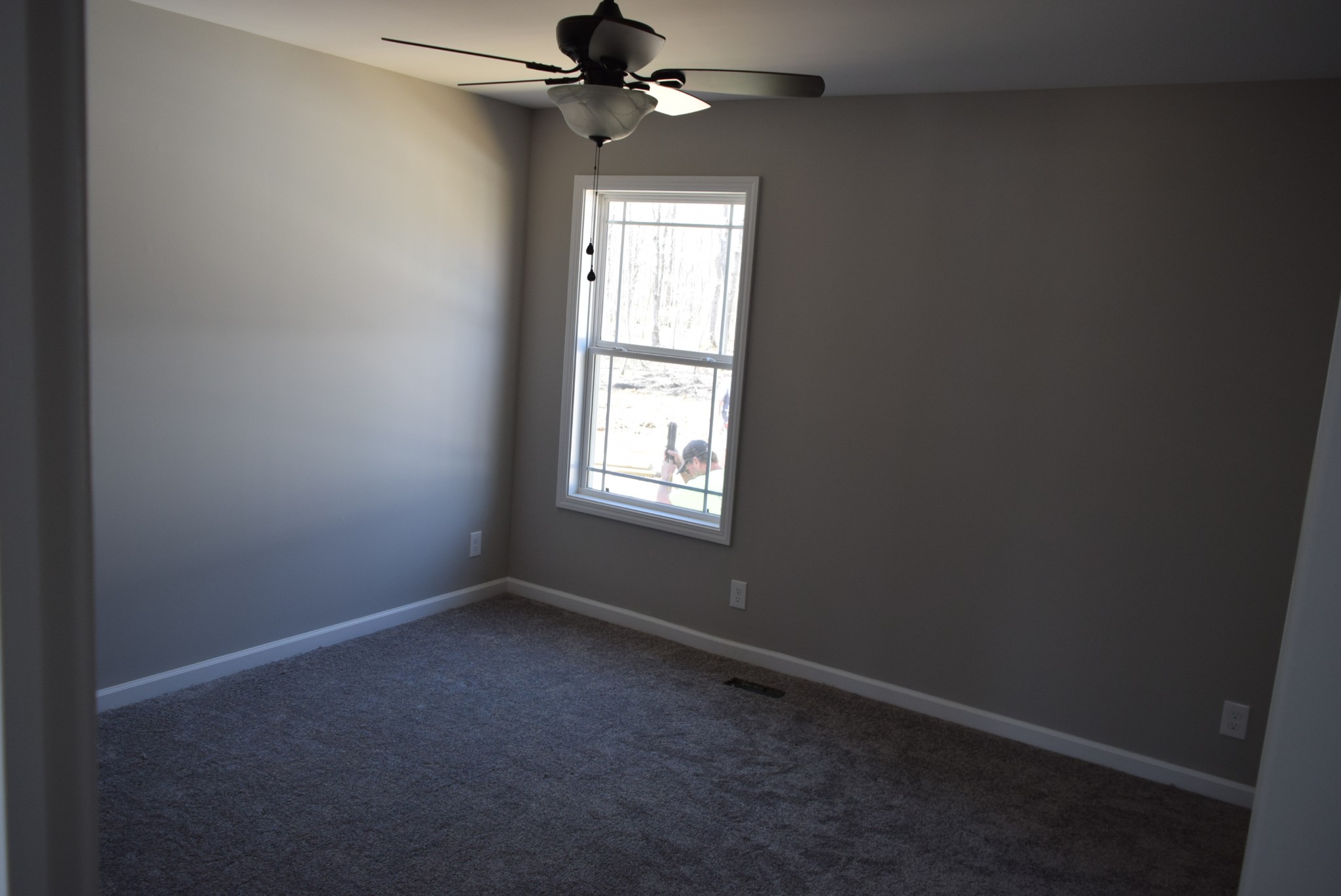 560 Ballard Road Manchester, TN 37355 - Photo 5 of 7 an empty room with a window and a fan