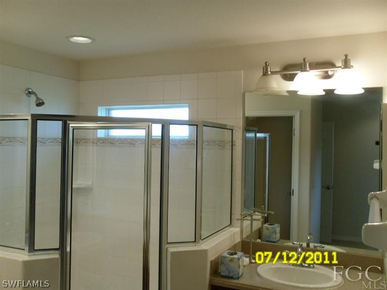 19710 Villa Rosa Loop Fort Myers, FL 33967 - Photo 5 of 5 a bathroom with a sink and a mirror