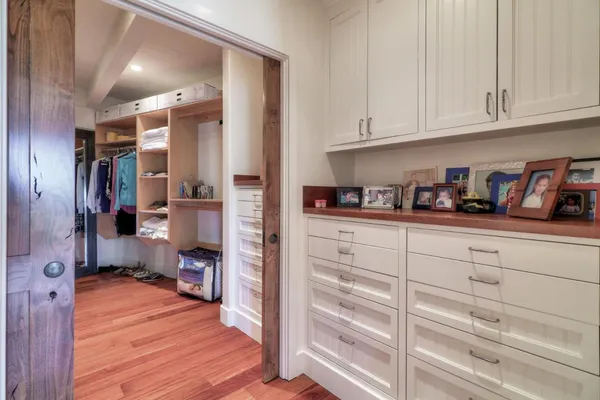 a spacious bathroom with a granite countertop sink a mirror and a