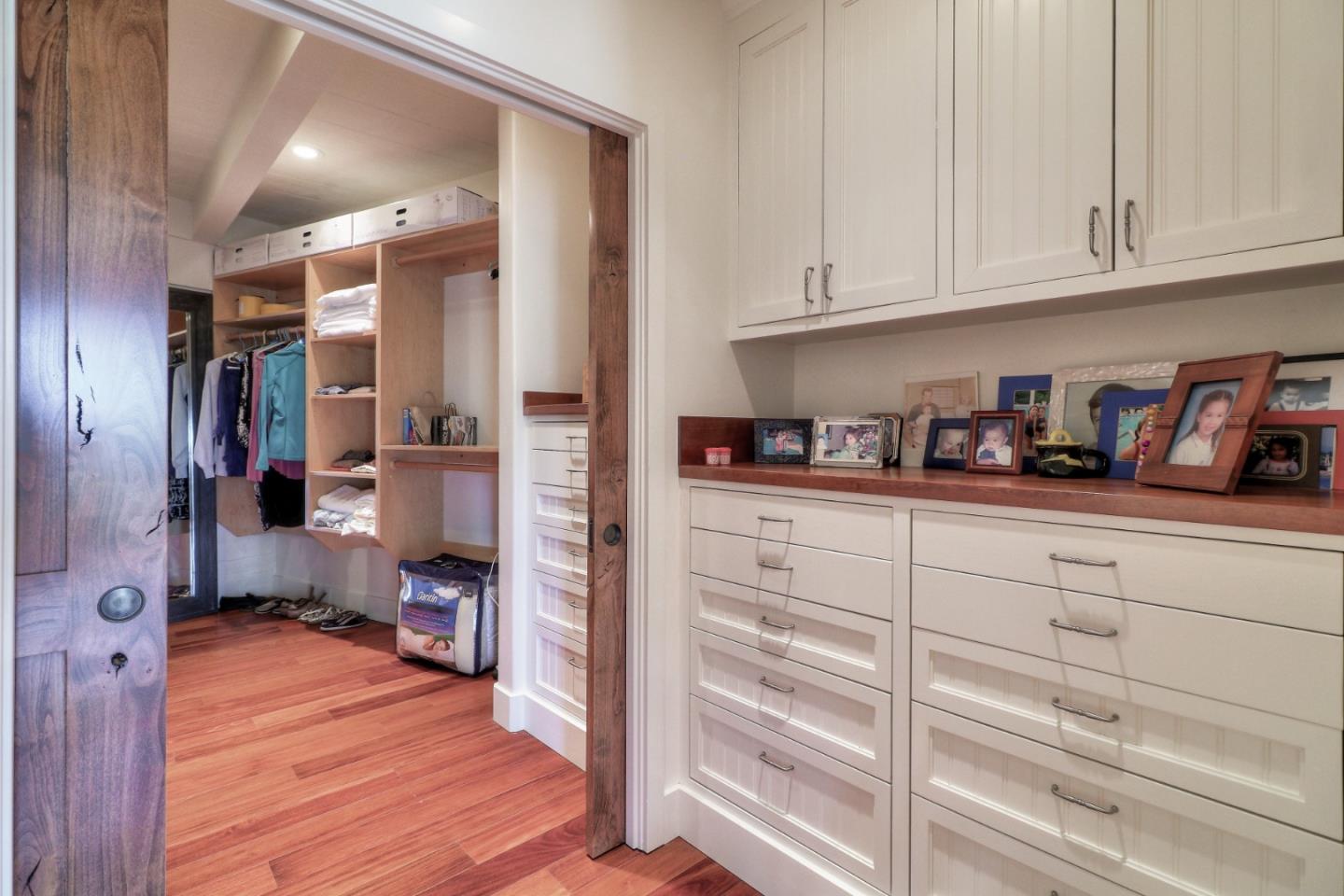 500 El Caminito Road Carmel Valley, CA 93924 - Photo 38 of 105 a kitchen with cabinets and a wooden floor