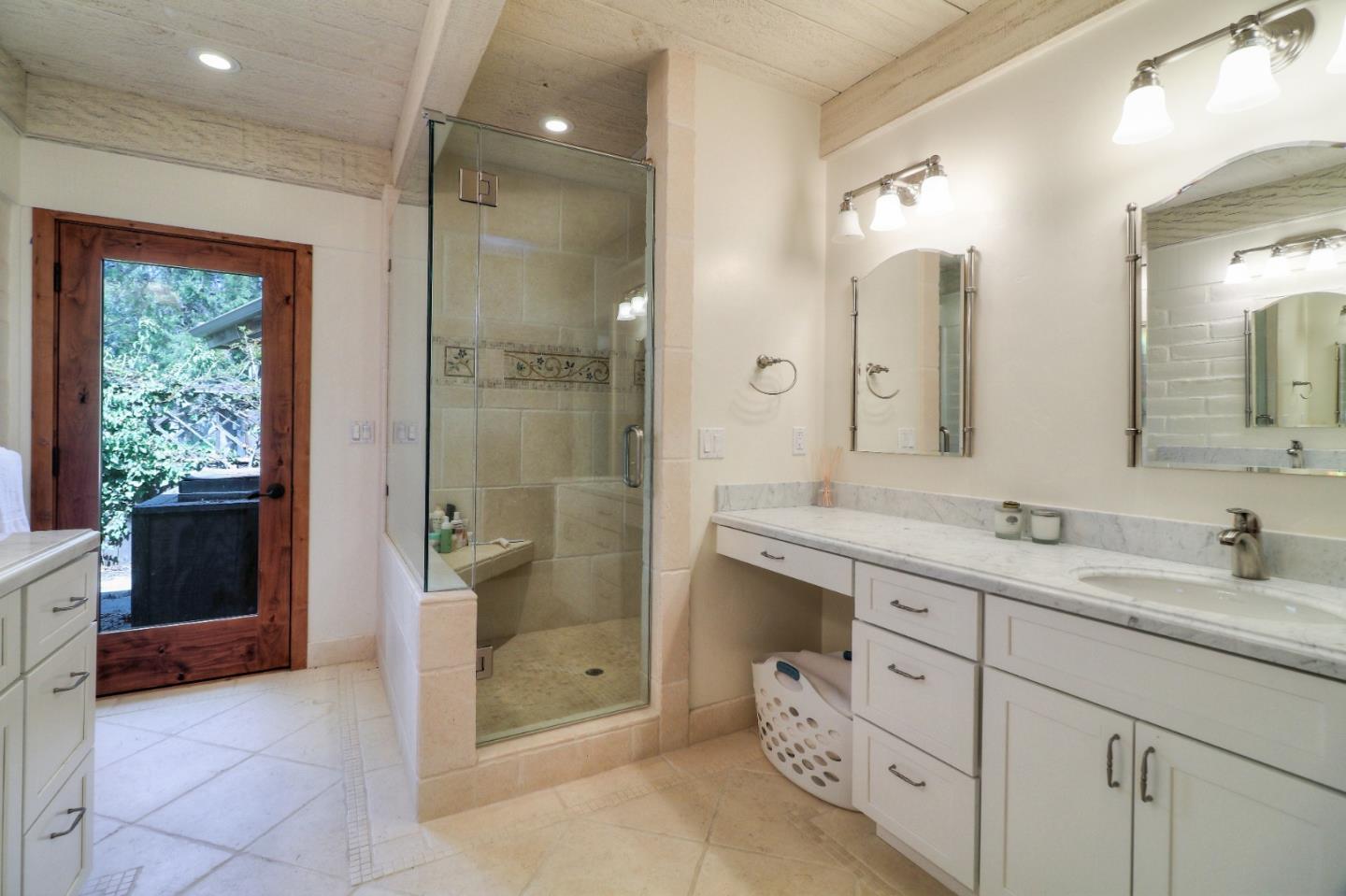500 El Caminito Road Carmel Valley, CA 93924 - Photo 39 of 105 a bathroom with a double vanity sink mirror and shower