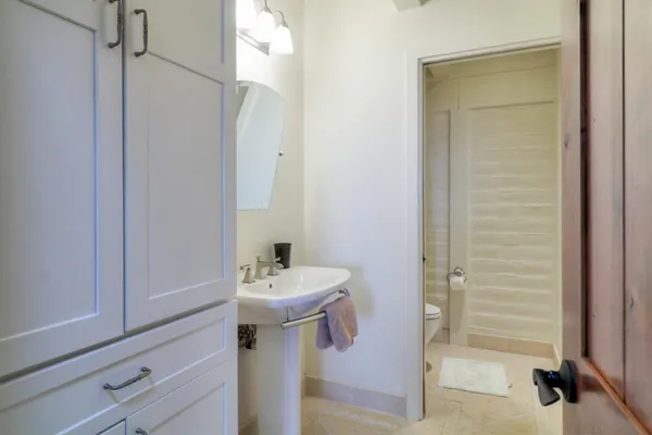 a kitchen with stainless steel appliances granite countertop a sink a stove a refrigerator and island