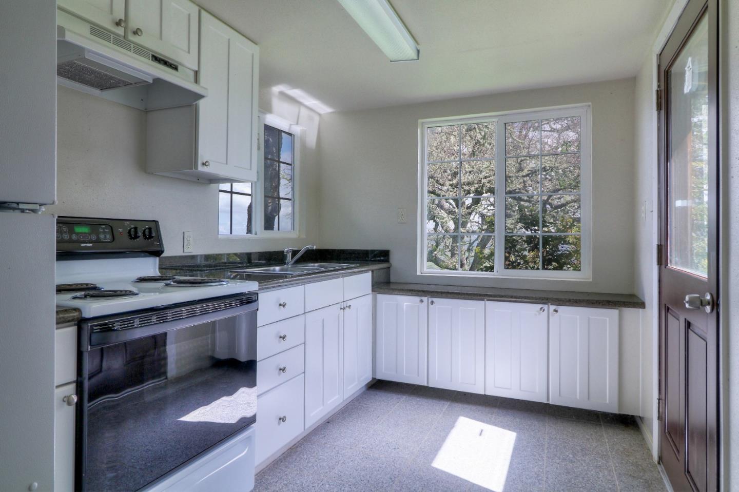 500 El Caminito Road Carmel Valley, CA 93924 - Photo 48 of 105 a kitchen with stainless steel appliances granite countertop a stove a sink and a refrigerator