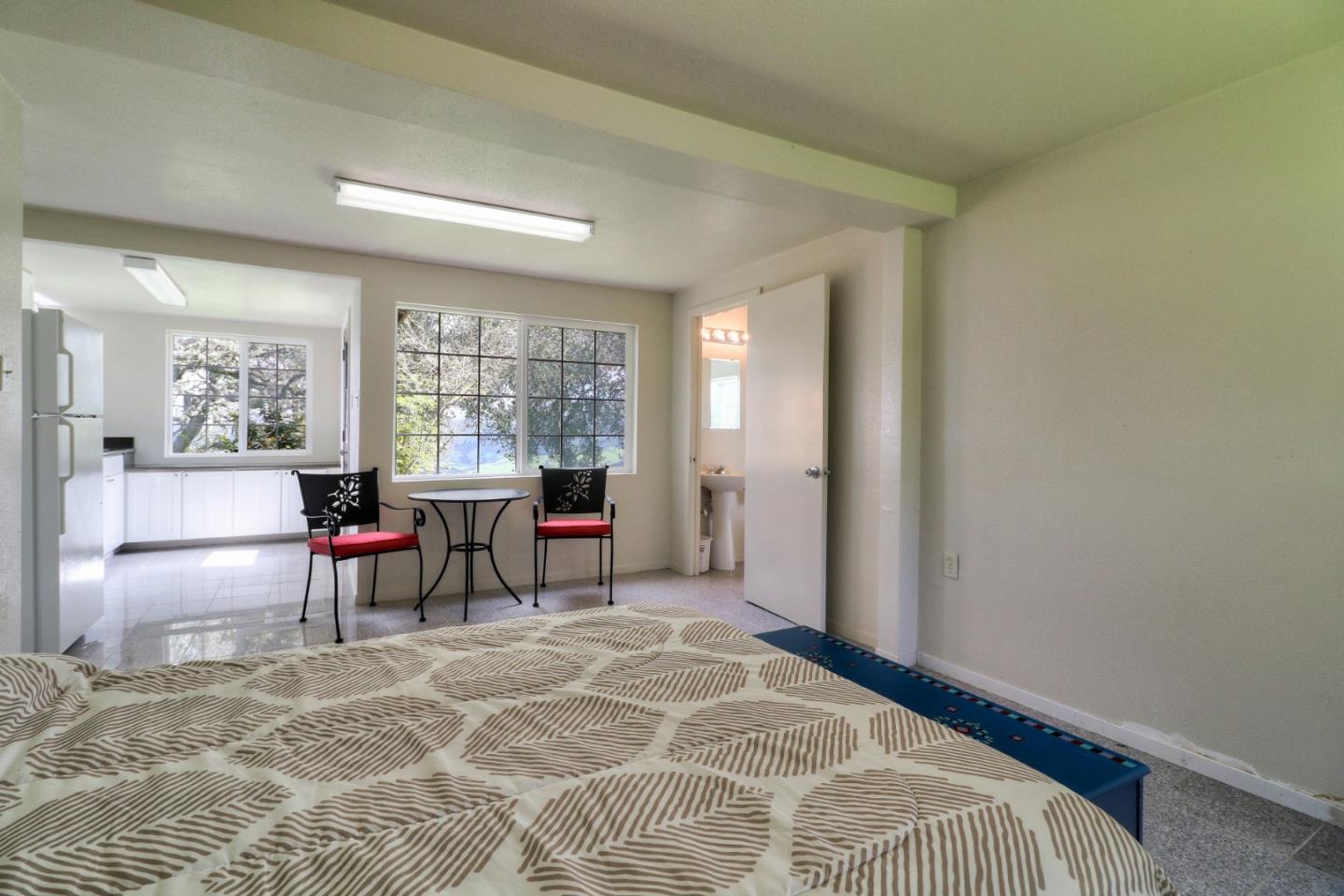 500 El Caminito Road Carmel Valley, CA 93924 - Photo 49 of 105 a bed room with a bed and a chair
