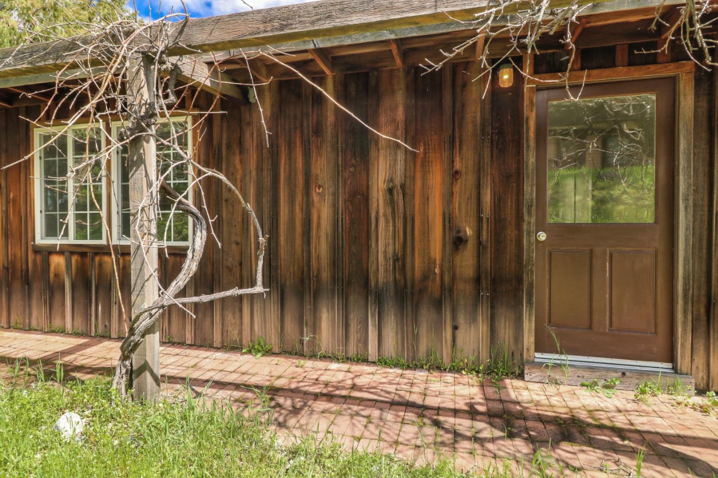 500 El Caminito Road Carmel Valley, CA 93924 - Photo 54 of 105 a view of a house with a small yard and wooden fence