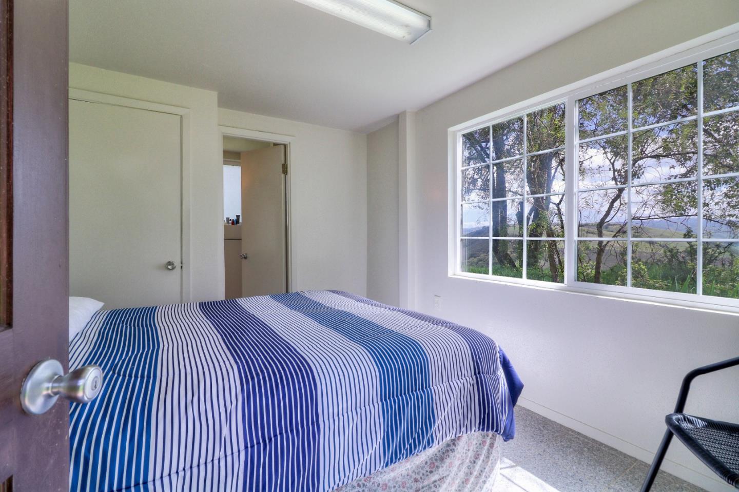 500 El Caminito Road Carmel Valley, CA 93924 - Photo 57 of 105 a bedroom with a bed and a window