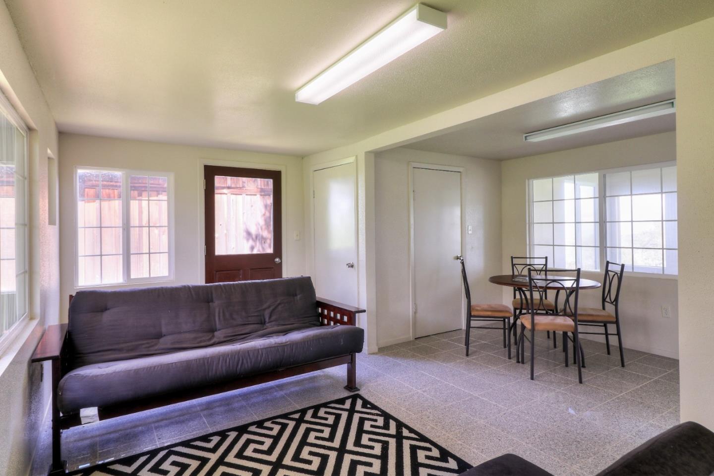 500 El Caminito Road Carmel Valley, CA 93924 - Photo 63 of 105 a living room with furniture a dining table and a window
