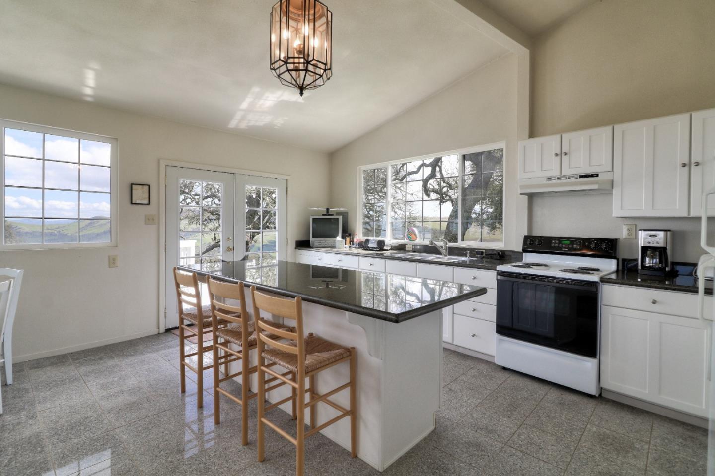 500 El Caminito Road Carmel Valley, CA 93924 - Photo 77 of 105 a kitchen with stainless steel appliances granite countertop a stove and cabinets