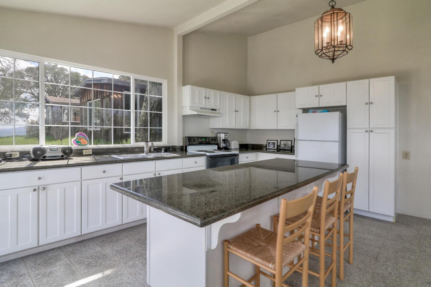 500 El Caminito Road Carmel Valley, CA 93924 - Photo 78 of 105 a kitchen with stainless steel appliances granite countertop a sink a stove a refrigerator and island