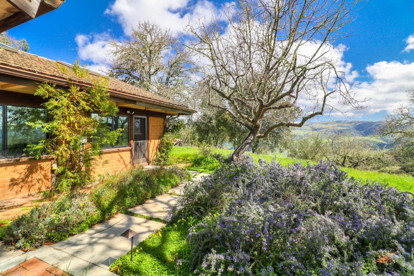500 El Caminito Road Carmel Valley, CA 93924 - Photo 10 of 105 a front view of a house with garden
