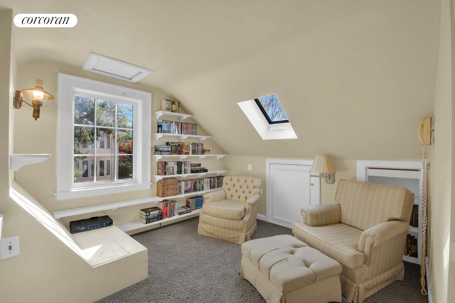 324 Beverly Road Queens, NY 11363 - Photo 13 of 20 a living room with furniture and a window