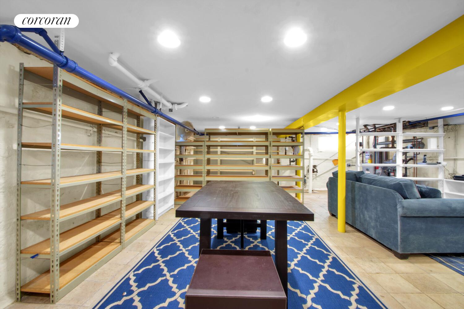 324 Beverly Road Queens, NY 11363 - Photo 18 of 20 a living room with furniture a rug and white walls
