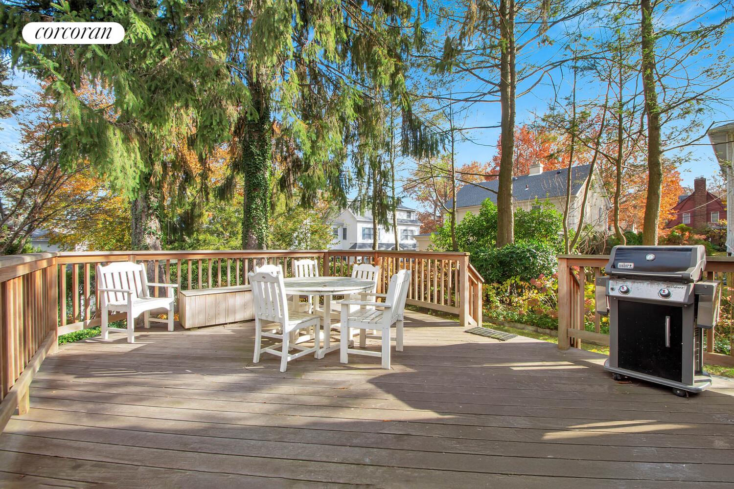 324 Beverly Road Queens, NY 11363 - Photo 19 of 20 a view of a chairs and table on the wooden floor