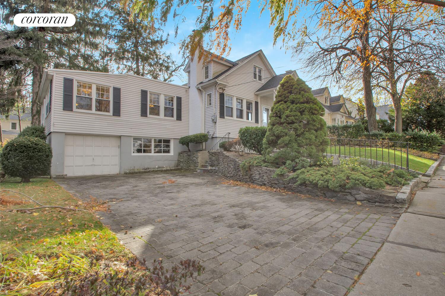 324 Beverly Road Queens, NY 11363 - Photo 2 of 20 a front view of a house with garden