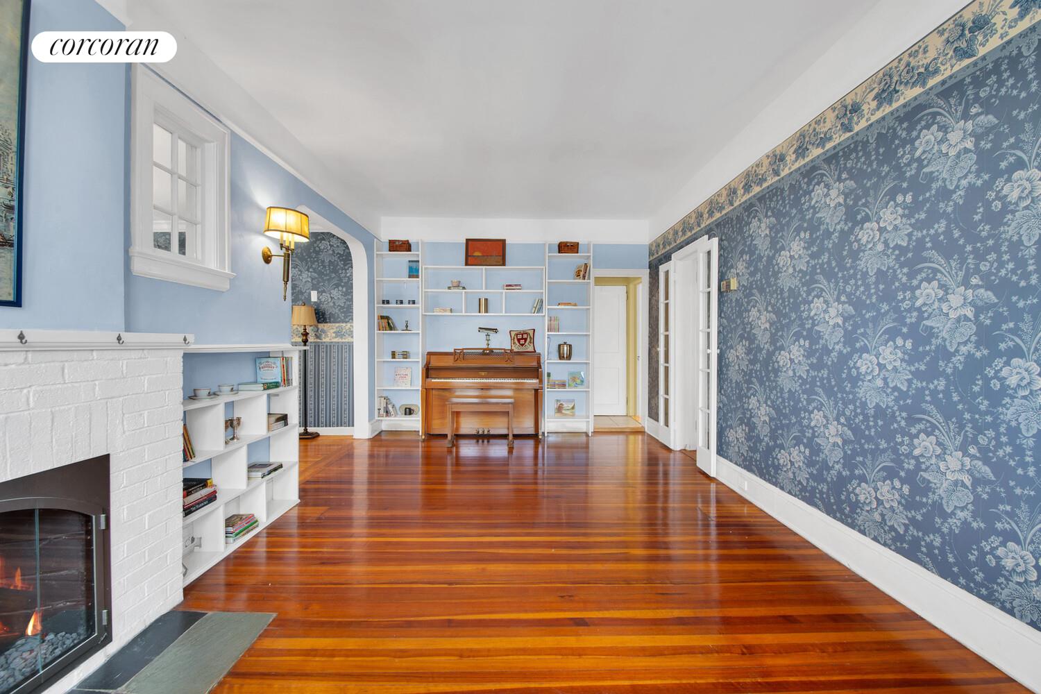 324 Beverly Road Queens, NY 11363 - Photo 4 of 20 a living room with furniture and a fireplace