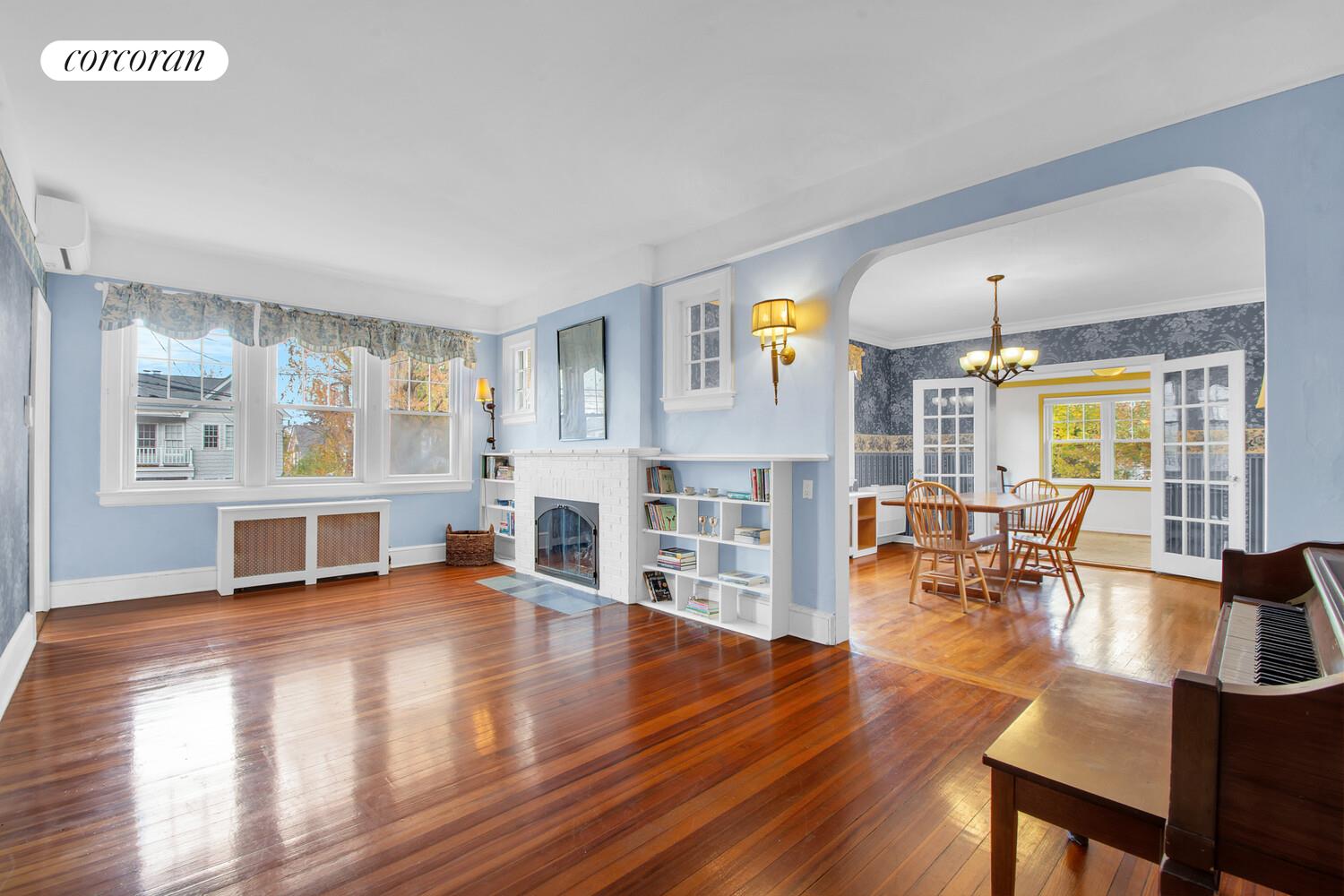 324 Beverly Road Queens, NY 11363 - Photo 5 of 20 a living room with fireplace furniture and a wooden floor