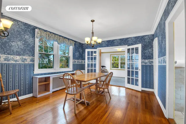 a living room with fireplace furniture and a wooden floor
