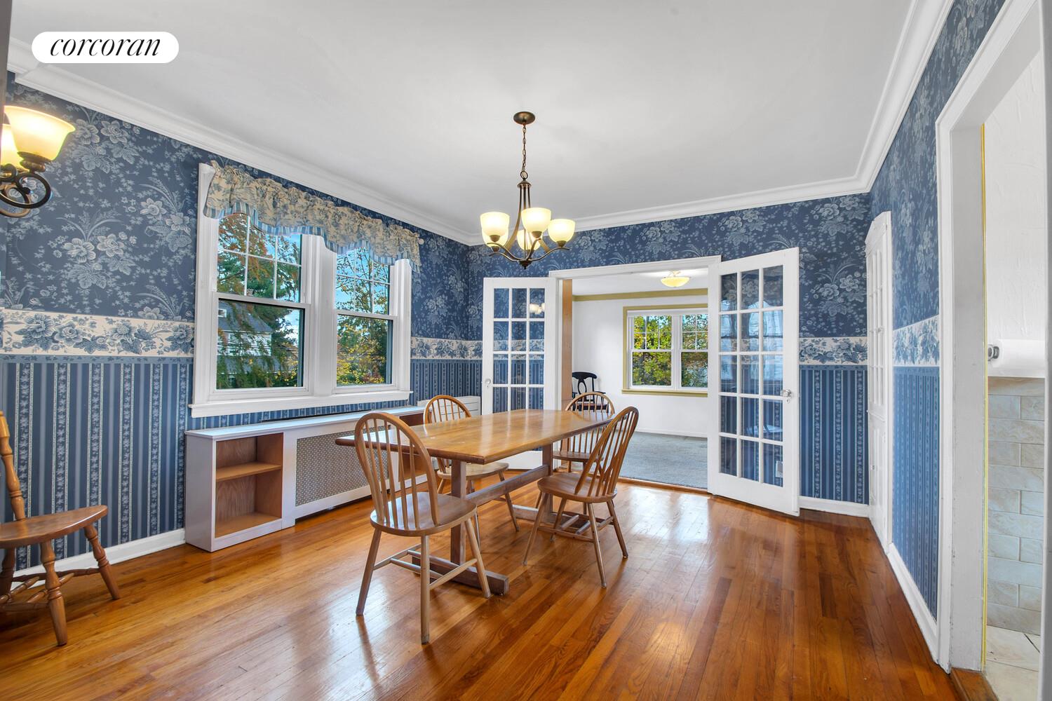 324 Beverly Road Queens, NY 11363 - Photo 6 of 20 a dining room with furniture window and wooden floor