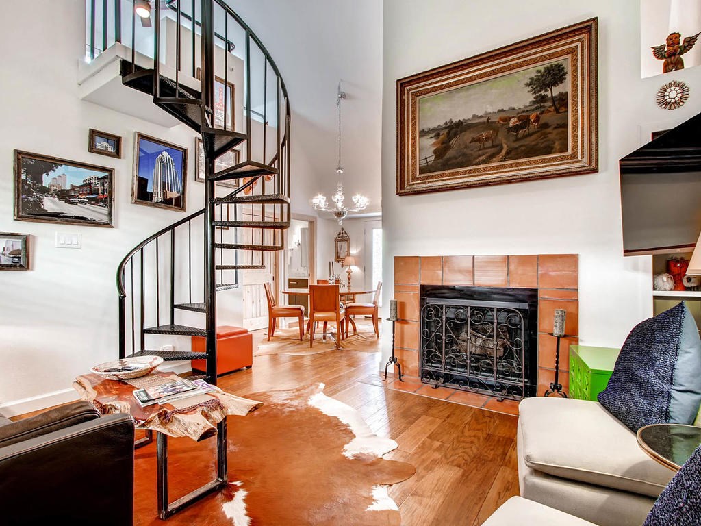 201 East 4th Street, Unit 234 Austin, TX 78701 - Photo 1 of 1 a living room with furniture a fireplace and next to a window