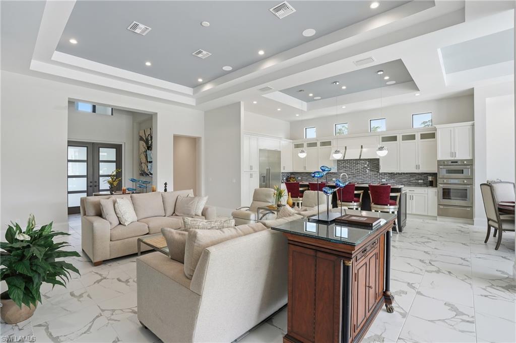 19086 Via Messina Way Miromar Lakes, FL 33913 - Photo 12 of 50 a living room with furniture kitchen view and a potted plant